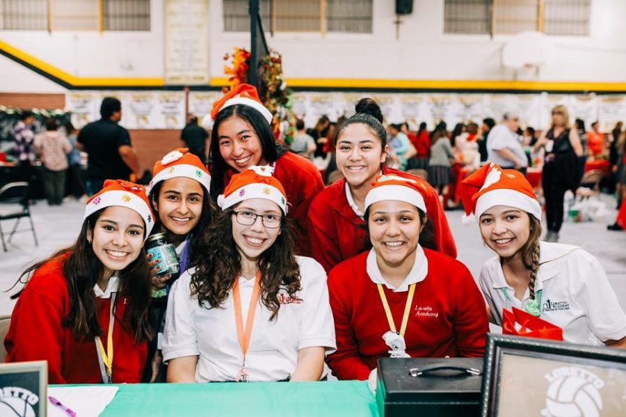 Photo courtesy of Alejandra Saldaña.  Members of the Loretto Athletics Association at their booth. 