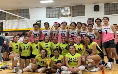 Loretto Varsity team with their Battle of the Sexes trophy and Cathedral team standing above. Smiling for the pictures because the game was a success. Photo courtesy of the author.
