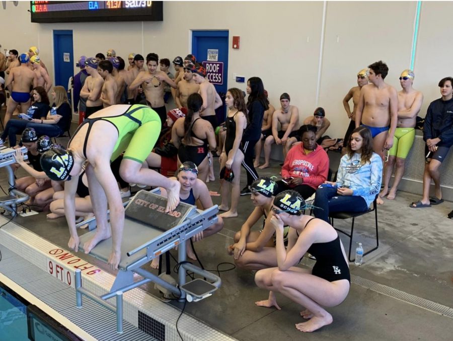 Elizabeth+Gunnison+getting+ready+to+swim+the+400+Relay%3B+behind+her+are+Charlotte+Schow%2C+Celeste+Hirschi%2C+and+Sofia+Ruiz.+Photo+courtesy+of+the+author.