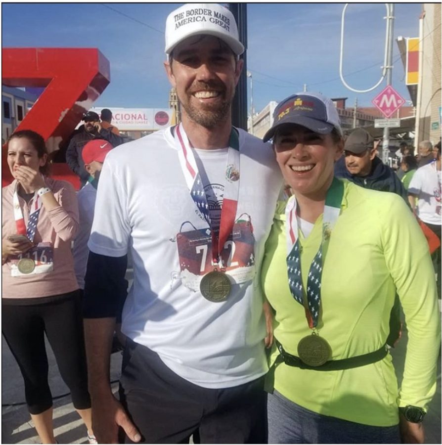 The JRZ monument on the background, showing the finish line. Gabriela Raux and Beto O’Rourke all sweaty and tired, yet smiling.