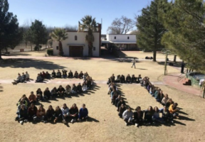 The class of 2020 sits to form their graduating year at their senior retreat. The seniors have been attending online school in place of attending on campus. Photo courtesy of the Loretto Academy Instagram.

