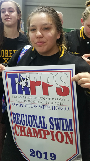 Analia Cortez celebrating the Loretto Swim Team’s Regional Victory 2019. Analia’s constant commitment to swimming has earned her the honor of Athlete of the Month.

