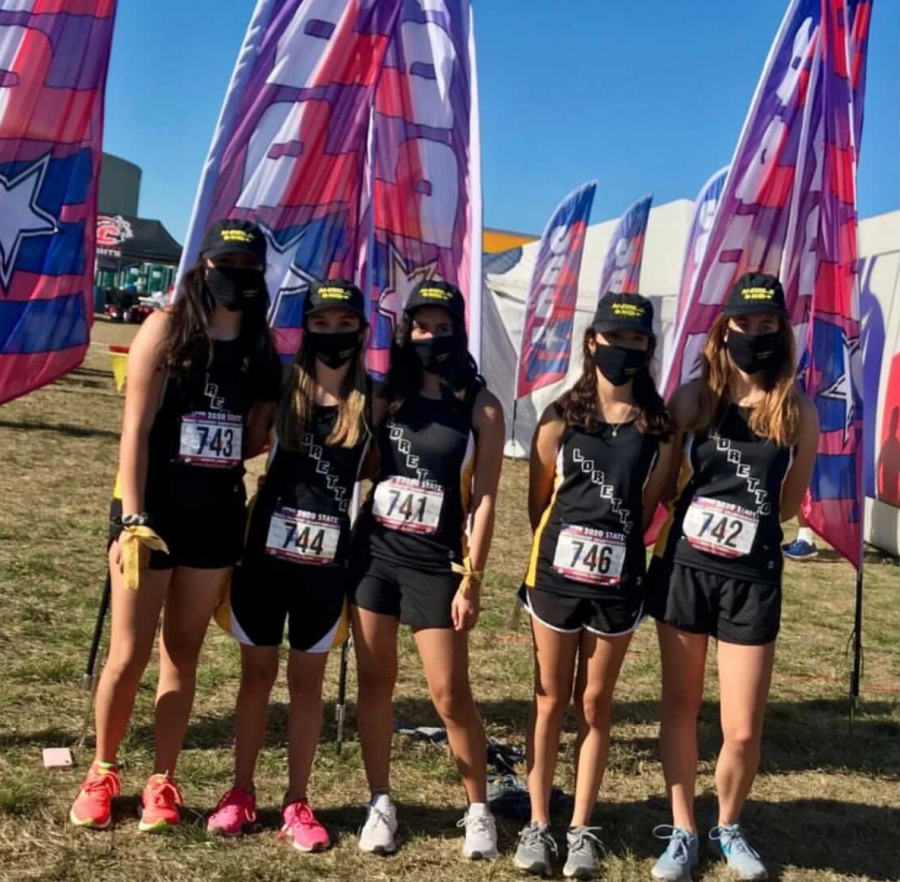 In the photo above are 5 girls, Britney Martinez, Mariah Martinez, Andrea Baeza, Amanda Torres, and Maria Hobbs (from right to left) on the Loretto Cross Country team. This photo was taken before their first run.