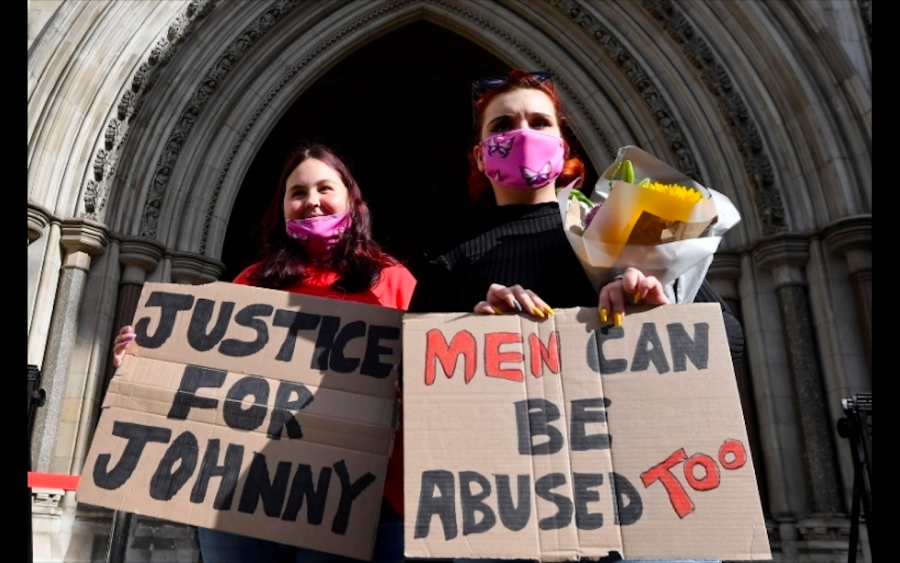 Masked+protesters+with+posters+demanding+justice+for+the+actor.+Hundreds+were+outside+London%E2%80%99s+High+Court.