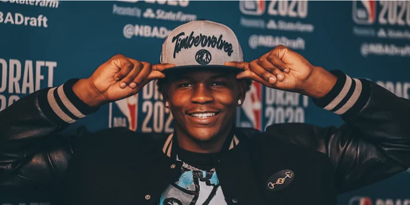 Anthony Edwards, the first pick in the 2020 NBA draft posing with a Timberwolves hat. After an impressive freshman year at Georgia, Edwards is heading to Minnesota.