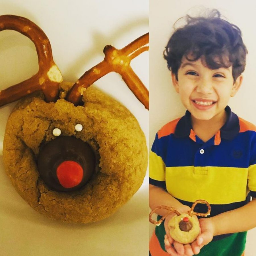 Jason, Mrs. Metcalfe’s son, last year with his reindeer peanut butter cookie.  This is a family recipe that they usually do on the holidays.