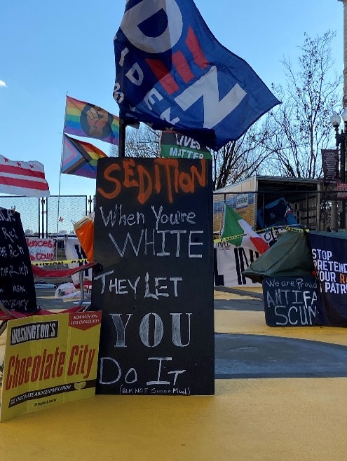 In Black Lives Matter Plaza in Washington, D.C., a sign reads “Sedition, When you’re white they let you do it (Black, not soooo much).” This comes after the riots led by Trump supporters were met with drastically different police forces than the BLM protests in the summer of 2020. 