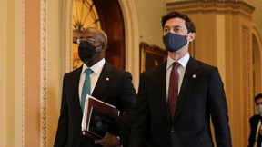 Senators Rev. Raphael Warnock and Jon Ossoff walk through the Capitol on Inauguration day. They were sworn in shortly afterwards by Vice President Harris. 