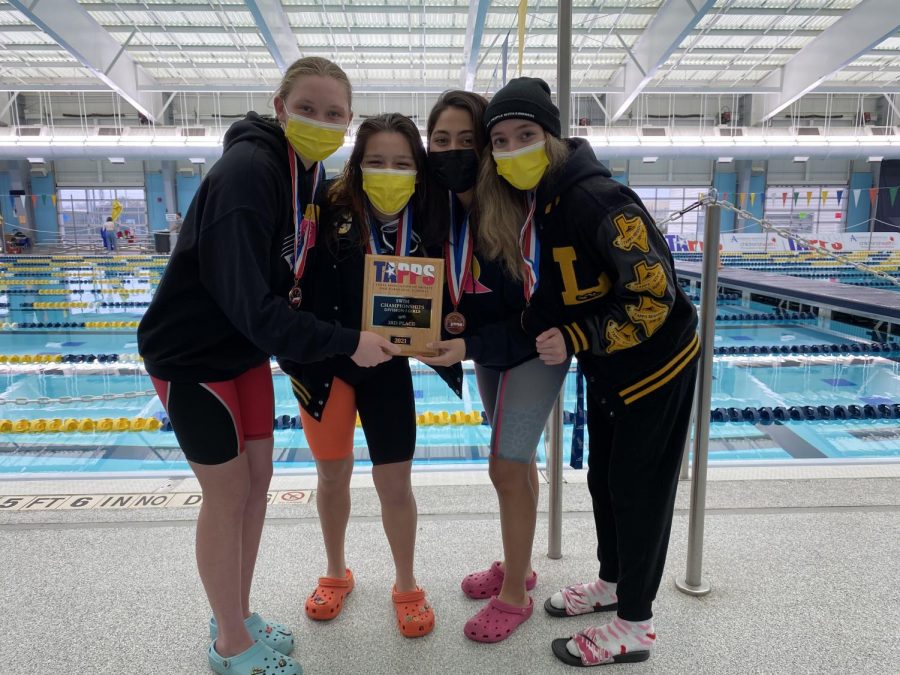 In the photo above show the swim teams seniors; (left to right) Celeste Hirschi, Analia Cortez, Paulina Quiroz and Laruen Barjas. The girls pose for a picture with their third place plaque after the meet.