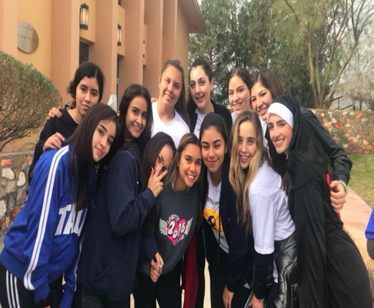 A+group+of+Loretto+students+smile+big+for+a+photo+before+the+race+begins.+This+picture+is+from+2019%E2%80%99s+Nun+Run+held+on+a+cloudy+Saturday+morning.%0A
