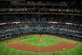 The MLB World Series game taking place with fans socially distanced throughout the stadium. There will be limited capacity fans at most of opening day games. 

