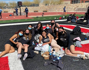 Some of the girls posing for a picture at one of the in-season meets. After a tough district, six girls go on to regionals.
