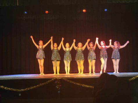The orchesis members join hands and bow to the audience. The orchesis members, along with all of the other dancers and singers, delivered a memorable performance. Photo courtesy of Mia Quinones.
