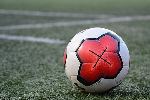 A soccer ball is placed in the middle of the pitch. The Loretto soccer players are preparing for their first match. Photo courtesy of Wikimedia Commons 