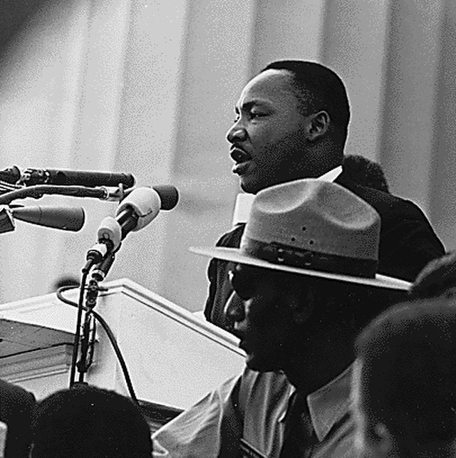  Martin Luther King Jr. speaks on the importance of civil                                 rights at a march. King inspired a movement to end segregation and racial injustice amid division. Photo courtesy of Wikimedia Commons.