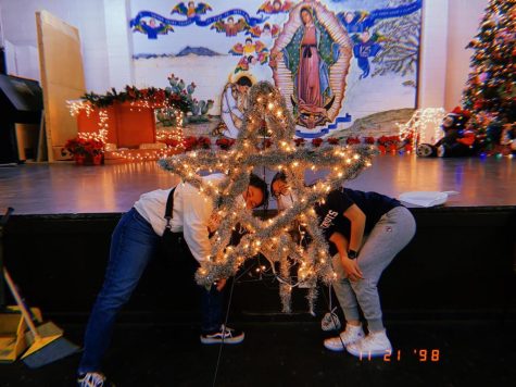 Loretto juniors, Jocelyn Valdez and Sophia Arellano, are shown helping set up for a Christmas party at Sacred Heart Church. This was just one of the many service learning activities that students have accomplished this year. Photo courtesy of Renata Muñoz.