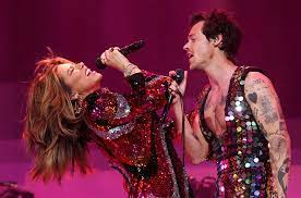 Shania Twain and Harry Styles perform onstage at the 2022 Coachella Valley Music And Arts Festival in Indio, California . After dueting  “Man! I Feel Like a Woman”, Styles took a minute to speak about how significant Twains music was to him as a kid while welcoming her onstage. Photo courtesy of Billboard