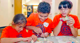 Kids work on interactive activities  while attending UTEP summer camp. Many camps are opening up all over El Paso during the summer to keep children entertained and engaged in learning. Photo courtesy of the El Paso Times.