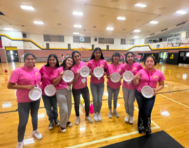 Loretto freshmen posing for a picture. They are holding up paper plates with their names on them.  Photo courtesy of Ava Muñoz.