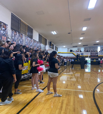 Overview of the gym while Loretto
was playing Cathedral in the first to five set 
volleyball game. Students sat on opposite sides to cheer on 
their school. Photo courtesy of Mia Montelongo 
