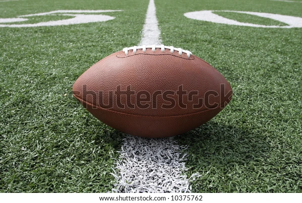 The 2022 College Football Playoff Selection Committee releases the Top 25. The top four teams (listed in order),  Georgia, Michigan, TCU, and Ohio State, will battle to determine the national champion. Photo courtesy of Shutterstock