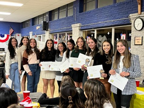 Lorettos junior varsity volleyball players receive awards at the Sports Banquet. The event was held in Lorettos cafeteria. Photo courtesy of Ms. Martinez 
