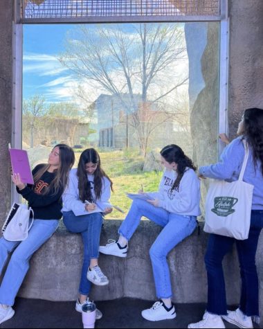 Students sit around the animal exhibits and write down adjectives for their poems. The girls were allowed to wear jeans and college sweatshirts of their choice. Photo courtesy of Carolina Fernandez