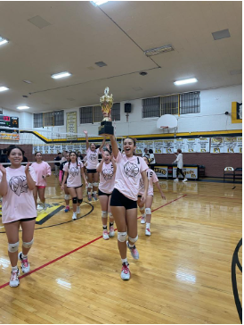 Loretto’s volleyball team celebrating their victory against Cathedral High School. Photo courtesy of Mara Escobar.
