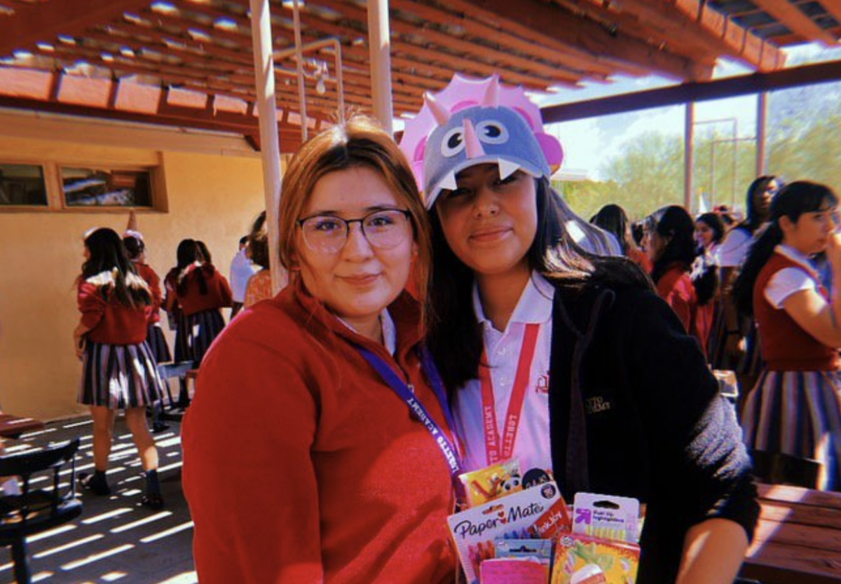 Sophomore Rebeca Ramirez gifting survival kit to freshman Nicole Meza.
Photo courtesy of Nicole Meza