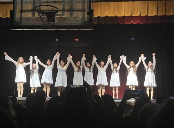 Loretto Academy’s Orchesis takes their final bow after their winter show. Photo courtesy of Maria Aldana.