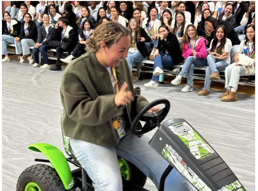 Senior, Ana Orozco racing during Shout Week assembly to celebrate how much money Loretto raised during the week’s festivities. Photo courtesy of Angelica Castorena.
