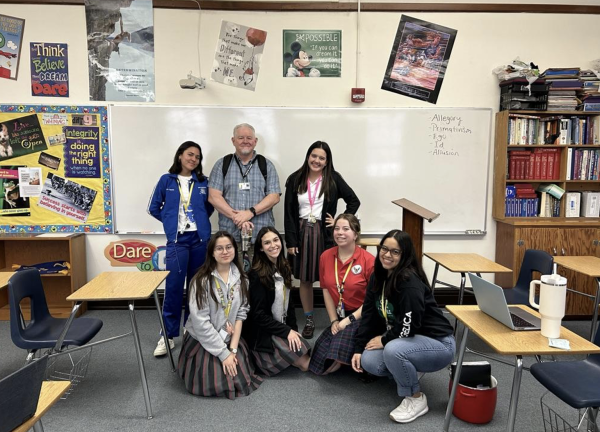 Mr. Causey along with The Prax staff. Altogether, the class discussed current events news. Photo courtesy by Paulina Garcia 