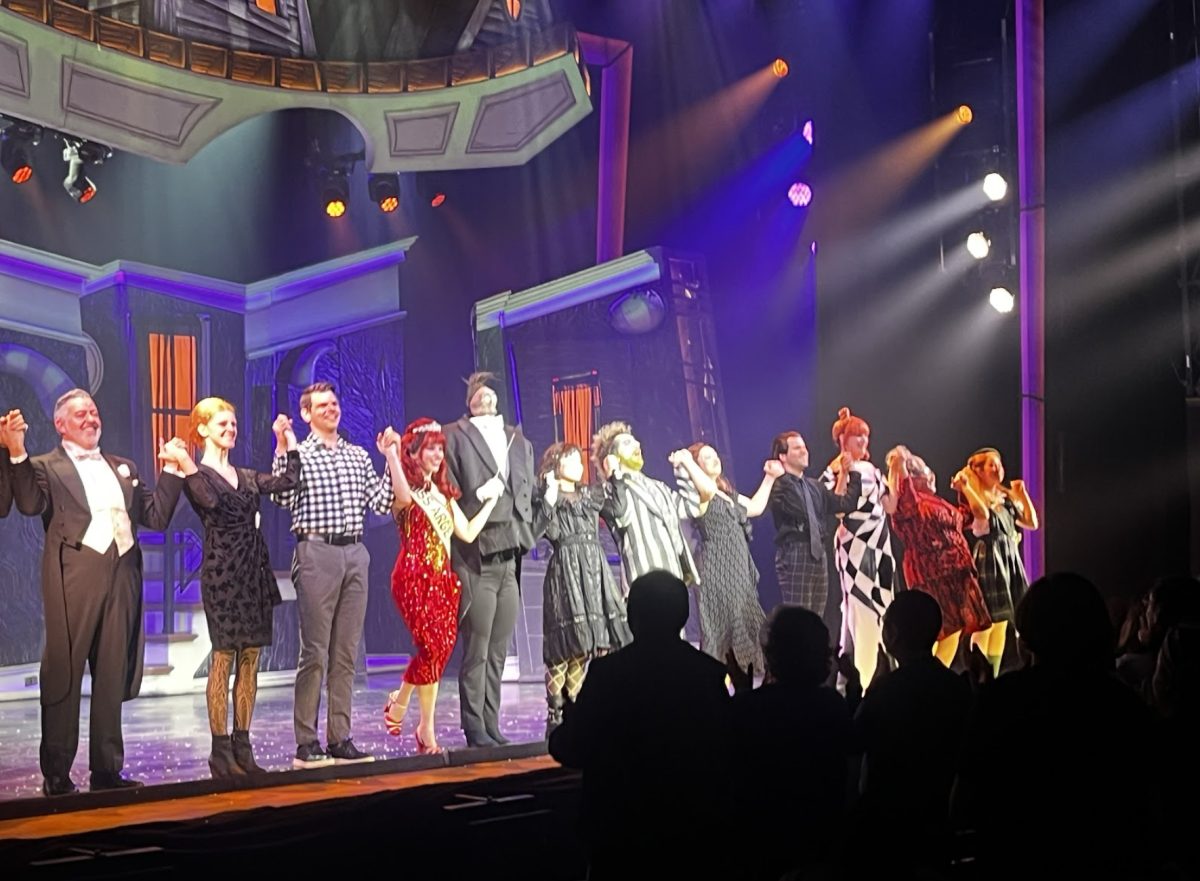 The cast of Beetlejuice The Musical giving their bow at the end of the performance. Beetlejuice and Lydia played by Sophia Aknin and Justin Collette are front and center. 