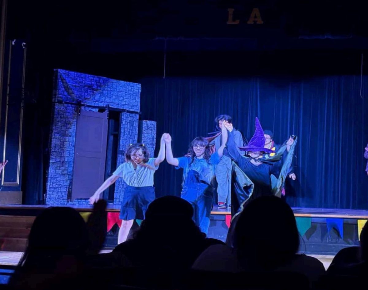 Juniors Ann Marie Franco and Niah Gutierrez, and sophomore Lorelai Martinez bow before the stage after their first performance, photo courtesy of Olivia Montelongo.