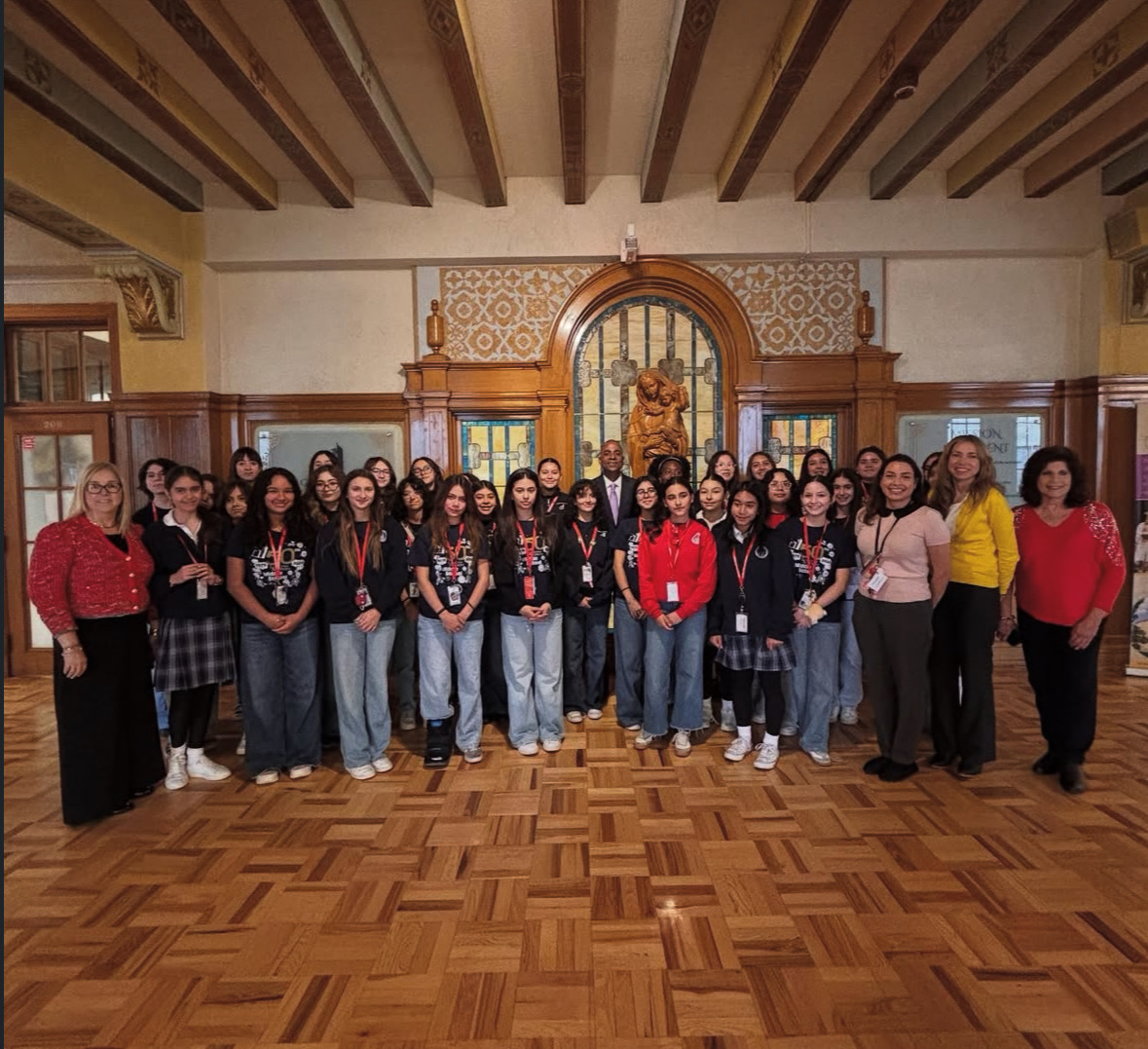 Mayor Renard Johnson with the eighth grade class and faculty who helped organize the event. The student’s faces are shining, motivated by his story and leadership. Photo courtesy of the Loretto Academy Instagram page. 