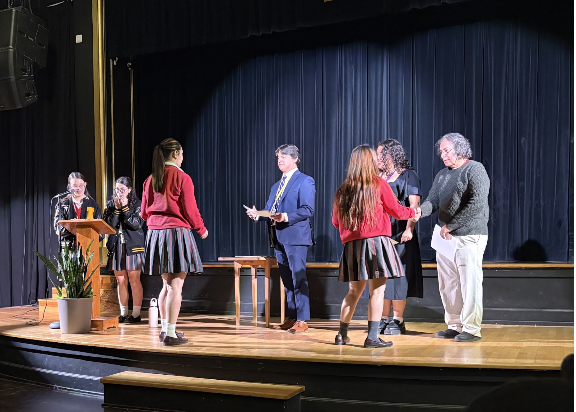 SNHS Co-Presidents and faculty sponsors passing out certificates of membership to inductees. Inductee’s names were recited, followed by a round of applause as they were recognized for their hard work. Photo courtesy of Vivienne Colon. 