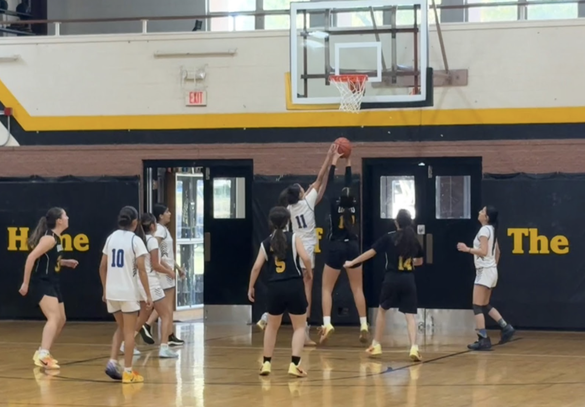  Loretto Academy basketball team playing against Clint High School in their JV tournament. Their teamwork and dedication ultimately secured their victory. Photo courtesy of Ava Payne.