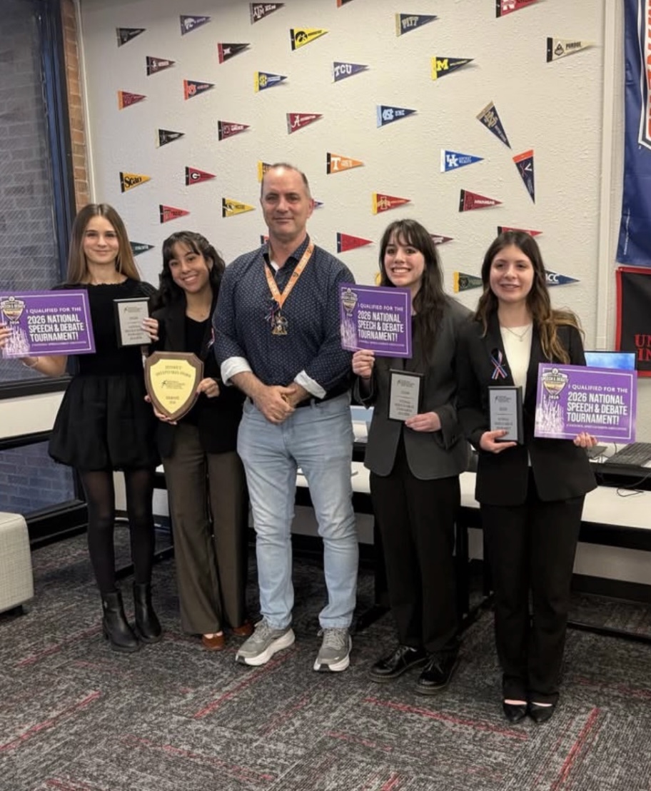 Four students, Andrea Palm, Juliana Puentes, Ann Marie Franco and Arantza Espino standing proudly at the West Texas National Qualifier. These students hold the papers and plaque of their wins in their hands. Photo Courtesy of the Loretto Academy Instagram Page. 