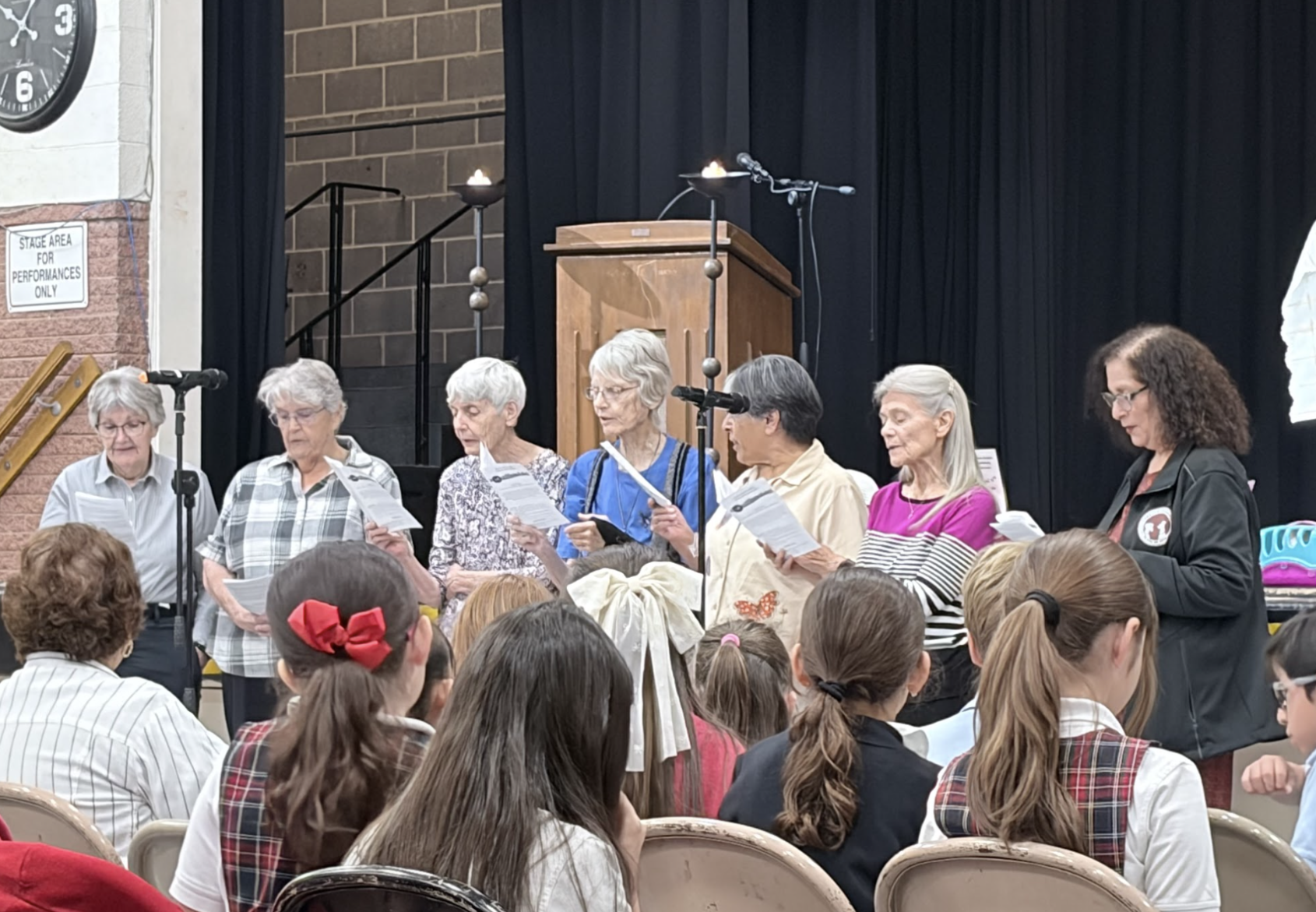 The sisters of Loretto gather before the congregation to renew their vows. As they do, the students, faculty and families listen intently to this  joyful ceremony . Photo Courtesy of Viviana Liano.